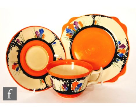 Clarice Cliff - Awakening or Peter Pan Crocus - An Athens shape cup, saucer and side plate circa 1931, hand painted with Croc
