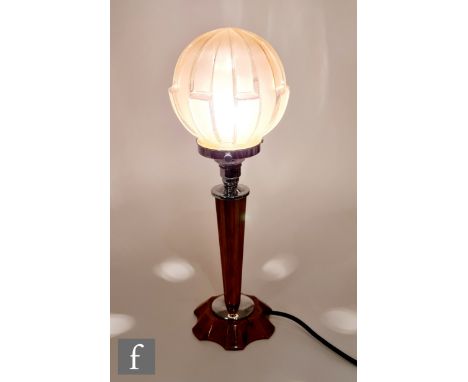 Unknown - A 1930s Art Deco table lamp, the scalloped amber coloured base and stem with black swirl inclusions, with pink fros