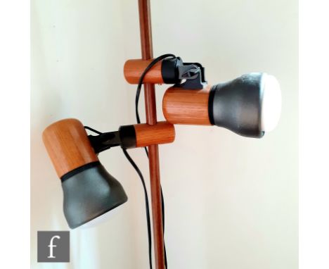 Temde - Swiss - A 1980s floor standing adjustable twin spotlight lamp, raised to a circular wooden base, height 139cm. 