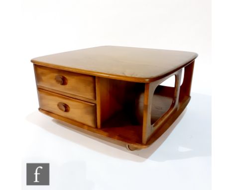 Ercol Furniture - A Windsor model 735 'Pandora's Box' elm coffee table, with compartmental sides and fitted with two drawers,