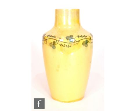 Ruskin Pottery - A small vase decorated in an all over yellow lustre with a painted garland to the shoulder, impressed mark a