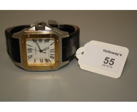 Cartier Santos. A gentleman's yellow gold and stainless wristwatch, the square dial with Roman numerals and sweep seconds han