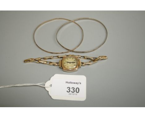 A lady's 9ct  gold wristwatch, by Rotary, circular dial with Arabic numerals, with cushion-shaped case, and 9ct gold strap, t