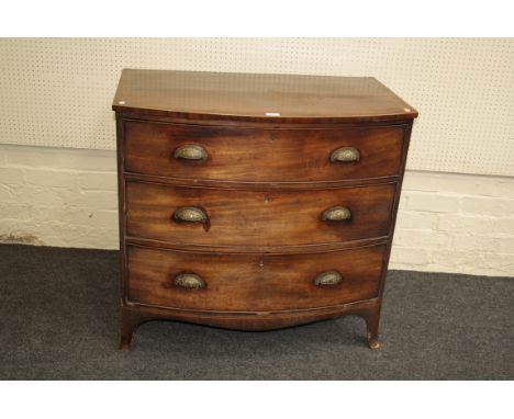 A George III mahogany, crossbanded and strung chest, the bow front top over three graduated long drawers on bracket feet. 90 