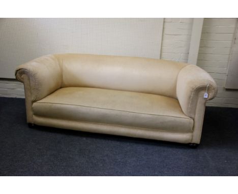 An early 20th century Chesterfield three person settee, later upholstered, on bun feet and castors, 200cm