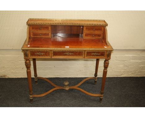 An 18th century style French kingwood, gilt metal mounted lady's writing desk, the gallery upstand over two pairs of trinket 