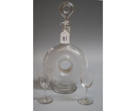 An Edwardian spirit decanter and stopper of pierced disc form, etched with bands of trailing ivy, on a spreading foot, 34cm, 