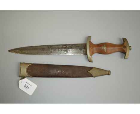A circa 1935 German Third Reich SA dagger, brown wood grip inlaid with eagle and swastika beneath SA device, double edge blad
