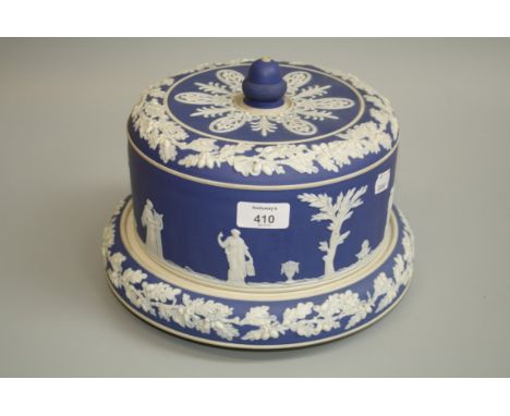 A late 19th century blue dip Jasperware cylindrical form cheese dish and cover, with acorn finial, decorated in relief with c