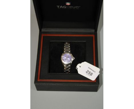 Tag Heuer, a lady's Tag Heuer stainless steel wristwatch, machined blue dial, baton numerals, date aperture and sweep seconds
