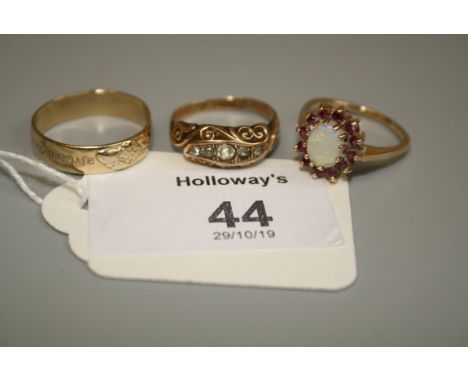 An opal and ruby cluster ring and two other rings 6.8g