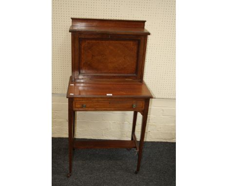 Maple and Co Ltd, an Edwardian mahogany, satinwood strung lady's bonheur de jour, the low upstand over a panelled fall enclos