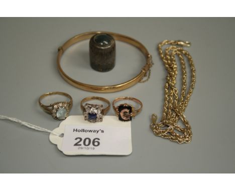 A monogrammed onyx set signet ring, two further gem set rings, a rolled gold bangle, a silver thimble and a gilt chain