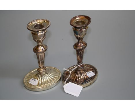 R. C. a pair of silver single sconce candlesticks, each with beaded rim, reeded and knopped tapering column, swept foot and w
