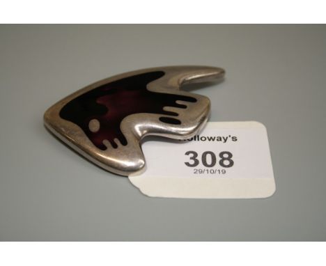 Georg Jensen, a silver and enamel brooch, by Henning Kopper for Georg Jensen, Model No 307, of abstract form with burgundy en