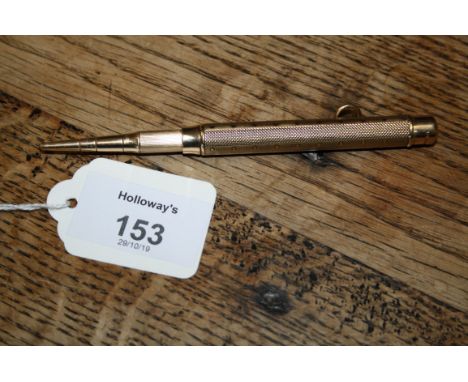 S Morden and Co, a 9ct gold propelling pencil, cylindrical, engine turned body with suspensory loop Gross weight 28.8g