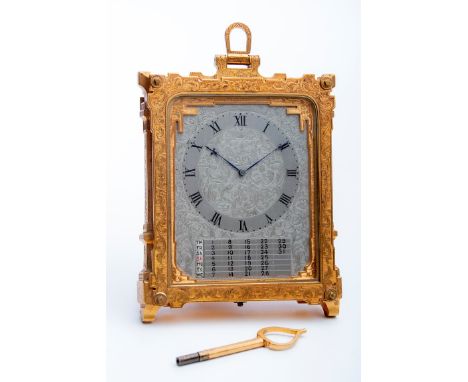 In the manner of Thomas Cole, a gilt brass strutt clock, the body and silvered dial with profuse engraving. The eight day mov