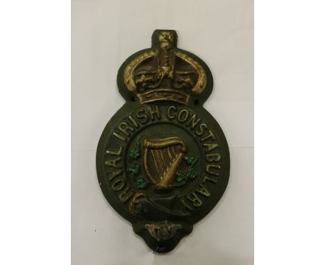 Political Interest: A shield shaped cast iron wall mounted Barracks Sign, for "Royal Irish Constabulary," surmounted with cro