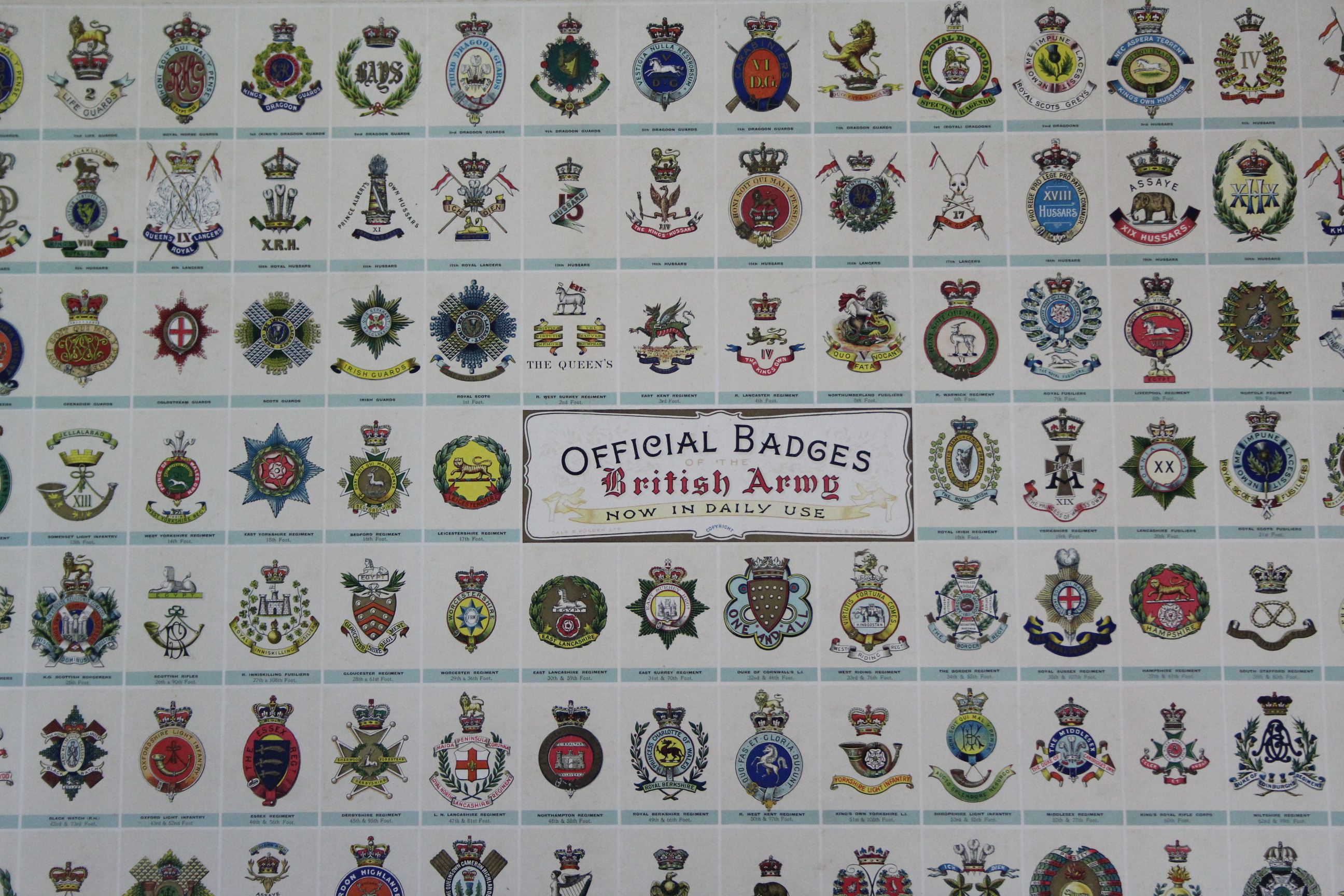 A large coloured print “Official Badges of The British Army, Now In ...