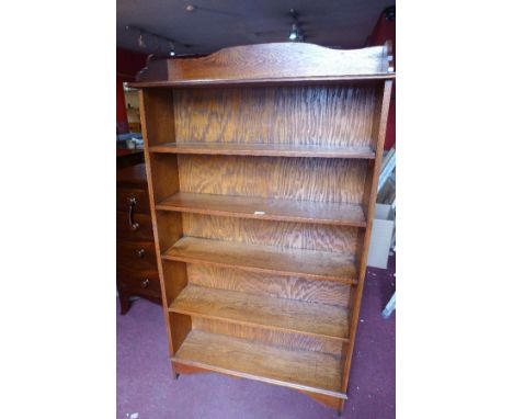 A large early 20th century oak open bookcase, raised on bracket feet, H.166 W.99 D.25cm 