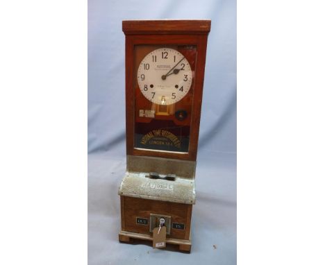 An early 20th century oak National Time Recorder/clocking in machine, H.99 W.34 D.28cm 