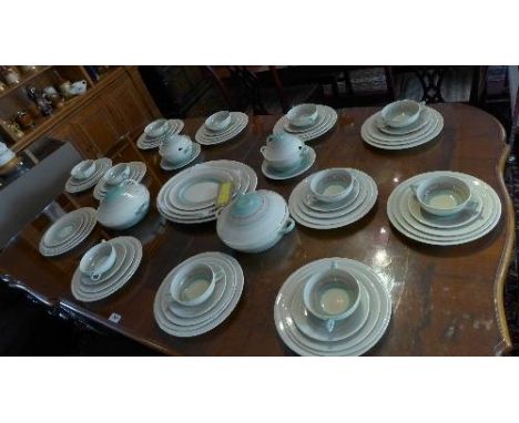 A large Art Deco Susie Cooper dinner service, comprising tureens, plates, soup bowls, etc. 