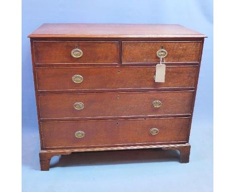 A Regency oak chest of two short, over three long drawers, raised on bracket feet, H.96 W.109 D.53 cm 