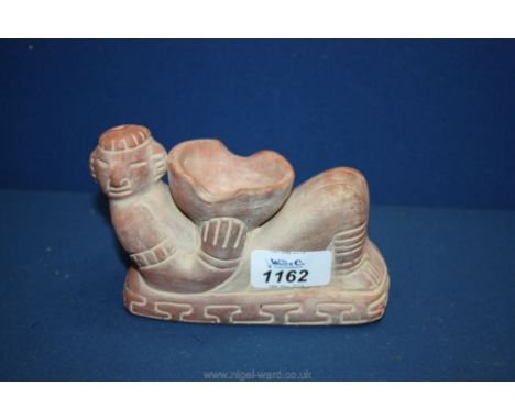 A Mayan earthenware figure.