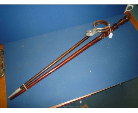 A John Collins shooting stick and a walking cane with spiral twist to the top.