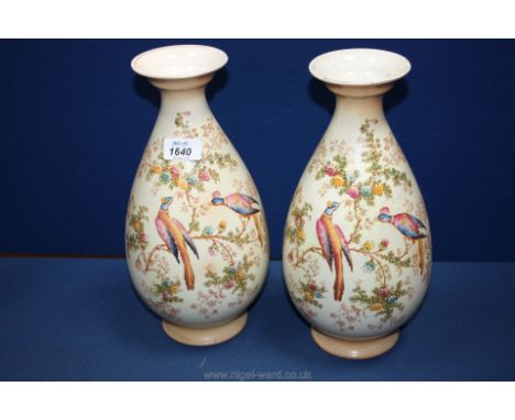 A pair of baluster shaped Vases by Crown Ducal 13" tall Vases decorated with birds and flowers, both having cracks.