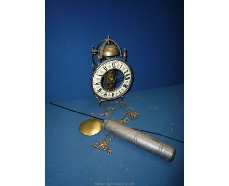 A reproduction lantern style bracket Clock, complete with weight and pendulum and striking on a bell, 9 1/4'' tall approx.