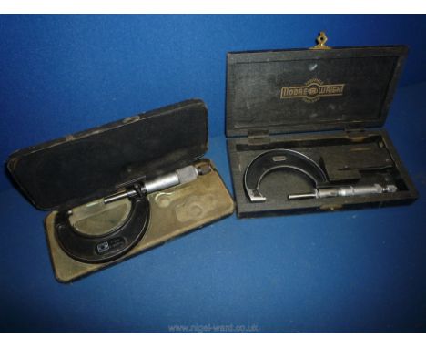 A cased Moore &amp; Wright micrometer 1"-2" in 0.0001 divisions and another in a wooden case with spanner.