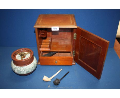 A smoker's Cabinet and contents including tobacco jar, clay pipe, bog oak pipe, etc.