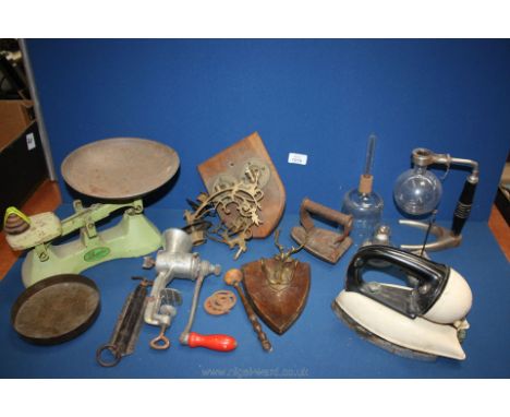 A quantity of miscellanea including old scales, mincer, steam iron plus flat iron, sconces, hall rack, laboratory equipment, 