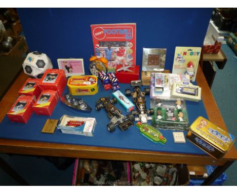 A box of mixed toys, two John Player Racing cars, clocks, chess pieces etc.