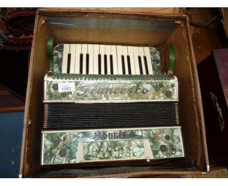 A vintage Francesco Modello Accordion in a leather case a/f.