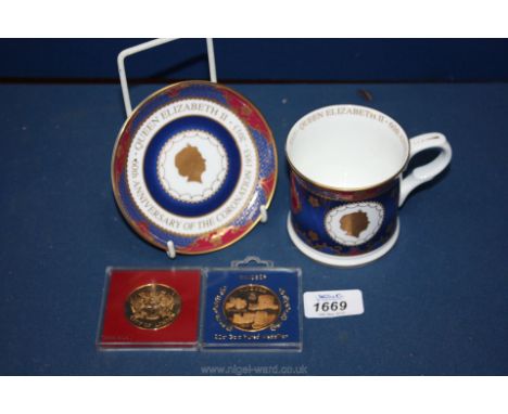 A Royal Worcester Coronation mug, boxed and two 22 ct gold medallions together with a Coronation circular tray, mug and tray 