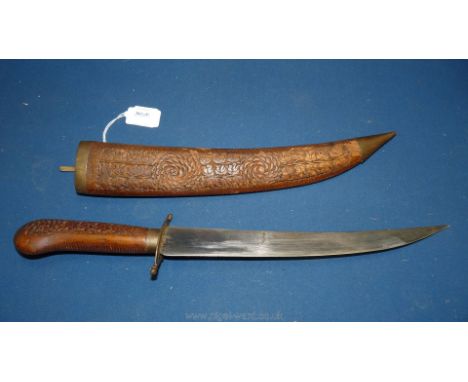 A curved Indian Dagger c.1940 with carved wooden handle and scabbard.