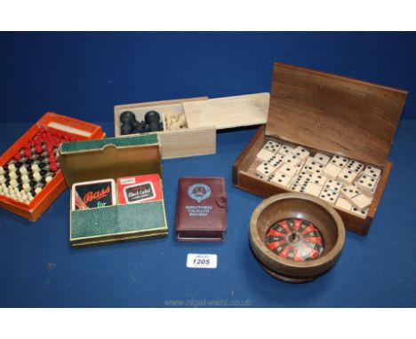 A box of playing cards, dominoes, chess set etc.