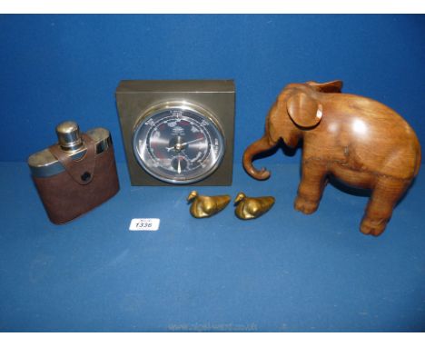 A wooden elephant, metal and leather hip flask, slate Barometer and two small brass swans.