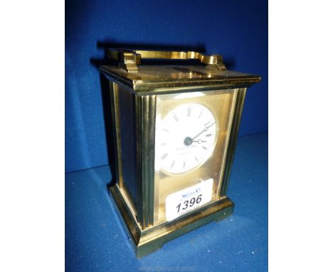 A brass Carriage Clock by Morell &amp; Hilton, battery operated.