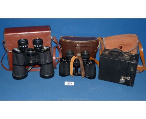 A pair of Tasco 10 x 50 wide angle Binoculars, cased and a pair of Regent binoculars, plus a cased Brownie camera.