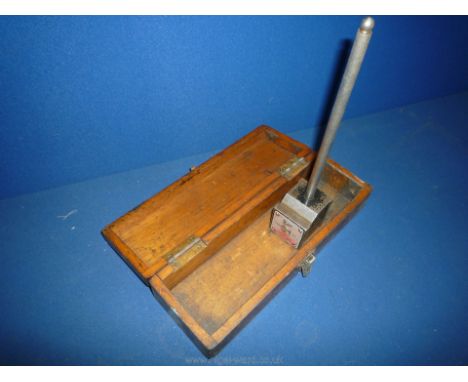 A wooden cased Eclipse Magnetic base for a dial gauge having push button attach and release mechanism 9 1/4" high.