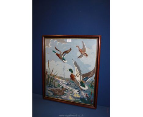 A part fire screen with tapestry of flying ducks.