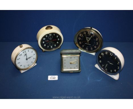 Four old alarm clocks, a hippo repeater, Chelsea, Smiths and a Big Ben repeater by Westclox and a cased Estyma travel clock.