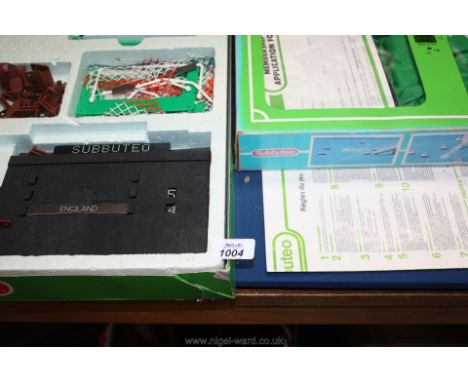 A complete boxed set of Subbuteo Italia 90 table Soccer, along with one other.