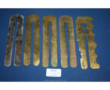 A quantity of Brass button shields