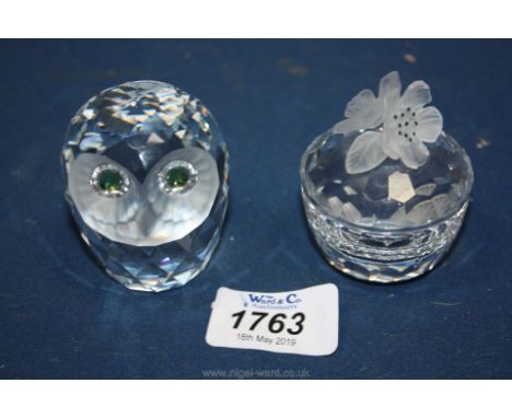 A Swarovski owl and a trinket pot and lid.