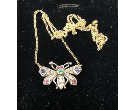 Rose diamond and gem set butterfly pendant and chain gold back silver front rose diamonds ruby ,emerald and sapphire small bu