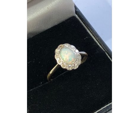 Antique 18ct gold &amp; plat opal and diamond halo ring central opal measures approx 6mm by 5mm with diamond halo weight 2.2g